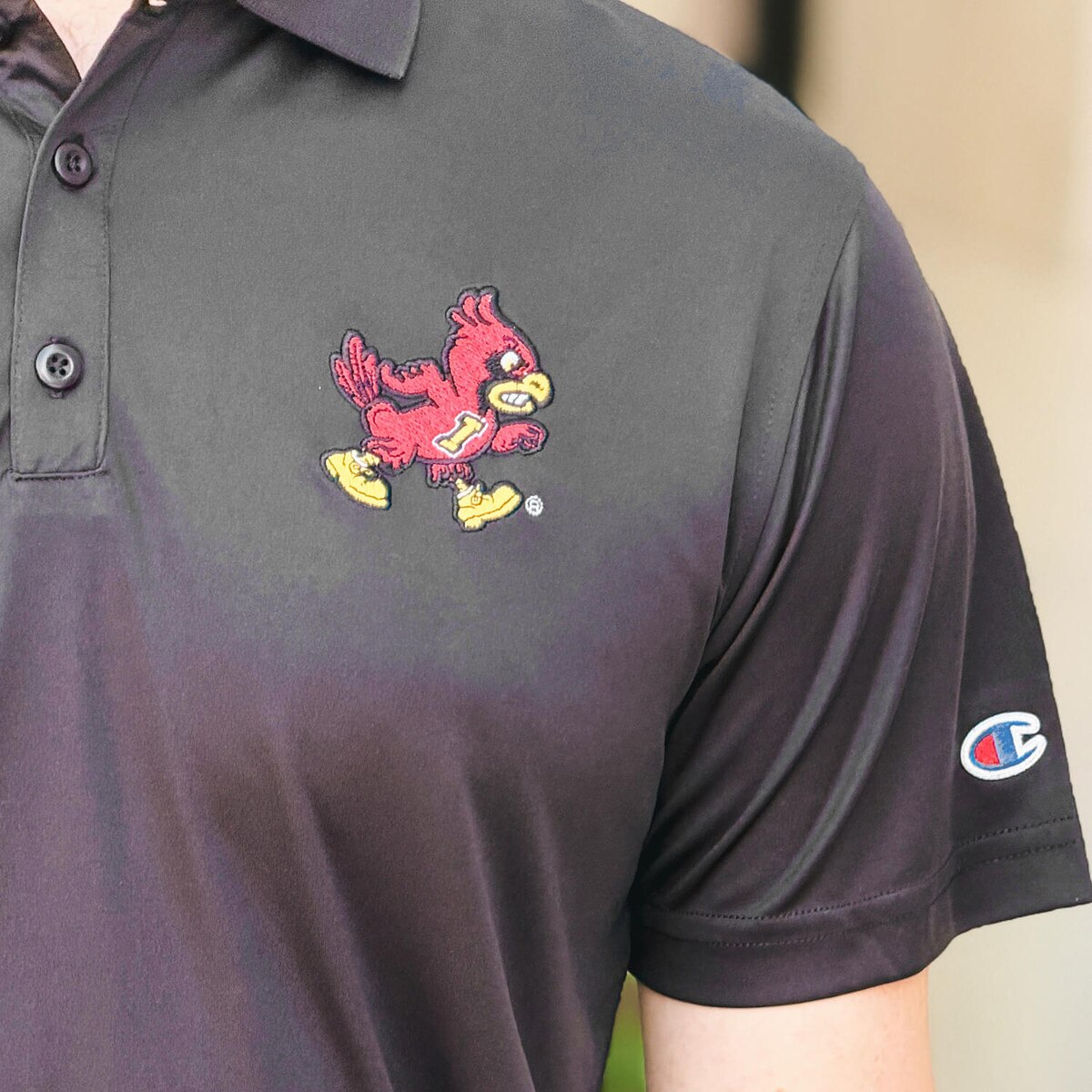 Champion Walking Cy Black Solid Polo SMU chest design close up